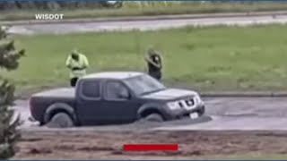 Driver moves road closure sign, gets stuck in wet concrete