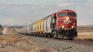 FAST!!! CP 8838 and CP 8887 highball CP 300 eastbound at Strangmuir, Alberta