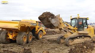 Caterpillar 963K tracked loader removing material