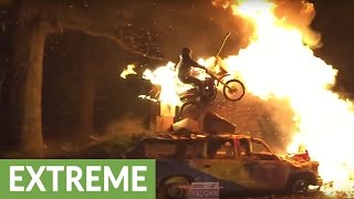 Insane bonfire dirt bike stunt captured in slow motion