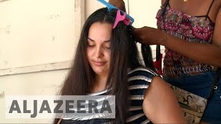 Venezuelan women sell hair to buy food