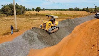 Biggest Project Bulldozer pushing black gravel Make a road, The battery truck is on a mission.