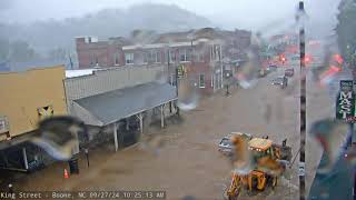 King Street in Boone flooded, cars moving through floodwaters