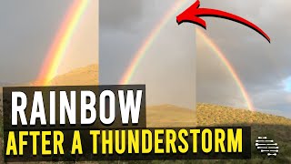 Lady Videoing a Beautiful Rainbow That Appeared After a Thunderstorm in a Valley