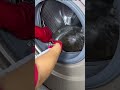 cleaning the washing machine using a brush