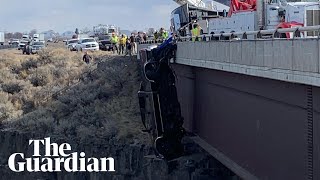 Two rescued from truck dangling over Idaho bridge