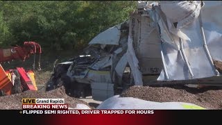 Driver pinned in semi-truck for hours rescued