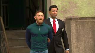 UFC Champ Conor McGregor escorted out of Brooklyn police precinct