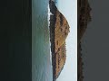 where the sea meets two tiny mountains harihareshwar beach maharashtra.