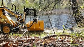 Branch Manager Clamshell bucket attachment with grading blade