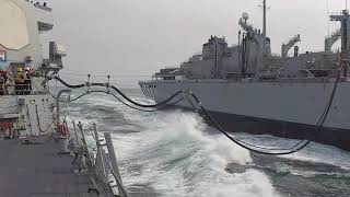 USS Ross (DDG 71) conducts a replenishment-at-sea with the fast combat support ship USNS Supply