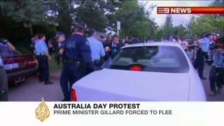 Australia's PM dragged from protest