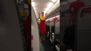 Air Arabia flight attendant instructing passengers on safety protocol #flightattendant #airarabia