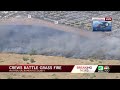 Crews battle grass fire in Mather on Thursday