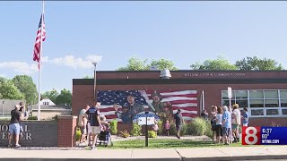 Friends, family gather for official unveiling of mural honoring fallen Wethersfield heroes