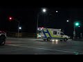 hamilton ambulance slowly transporting at intersection