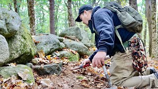 You have to see how much old stuff he just found behind this old rock wall