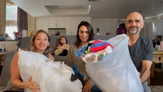 Someone threw away two bags stuffed with clothes! We saved them from the landfill