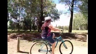 Kerry (a.k.a. mum) riding a bike at Dubbo Zoo