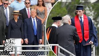 Towering Barron Trump walks at high school graduation as proud parents Donald an