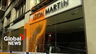 Climate protesters spray paint on Aston Martin showroom in London