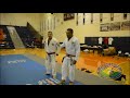 rickson gracie putting red black belt on pedro sauer