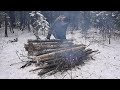 winter camping with no tent snow filled forest large campfire solo