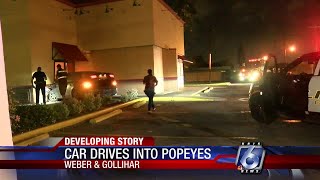 Car runs into Popeyes