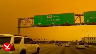 California sky turns apocalyptic orange as Hughes fire threatens LA