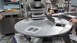 Automatic turntable tray sealing machine