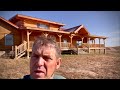 Elvie And Crew Stain The Exterior Of A Meadowlark Log Home