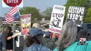 Protesters line Route 29 ahead of President Trump’s Charlottesville visit
