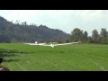 glider being towed by a plane for take off amlikon switzerlan 07 09 2014