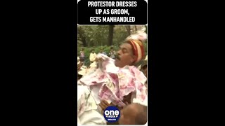 Delhi: Protester dressed up as a groom gets manhandled | Watch Video | Oneindia News