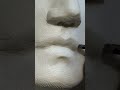 Carving a mouth in marble