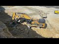 caterpillar 390d excavator loading caterpillar 775e dumper and trucks pyramis ate