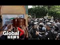 Israeli police charge at mourners carrying Al Jazeera journalist's coffin at funeral in Jerusalem