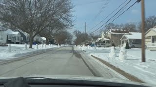 VIDEO | Snowmen line the streets in Cuyahoga Falls neighborhood