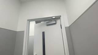 Door Closer - LCN in Ross Bathroom Hallway