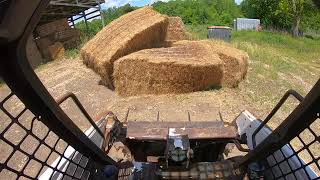 s130 bobcat moving bales