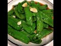 stir fried snow peas with garlic and oyster sauce a simple delicious vegetable dish. . .