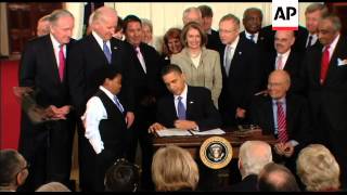 President Barack Obama signs the Patient Protection and Affordable Care Act