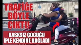 Motosiklet sürücüsü, arkasına iple bağladığı kasksız çocuk ile trafiğe çıktı.