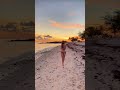 Noella at sunset taking photos on the beach in Key West 🏝️