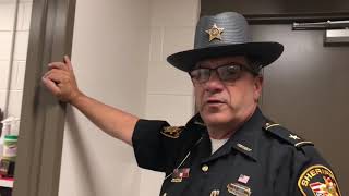 Stark County Sheriff George Maier gives tour of renovated dog pound and plays with puppies