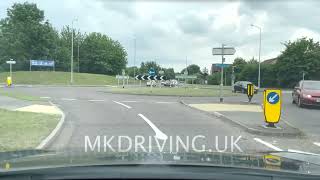 Unmarked roundabout 2nd exit straight ahead