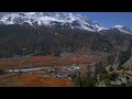 aerial establishing shot bhraka village stone house buildings on hilltop. manang district. northern