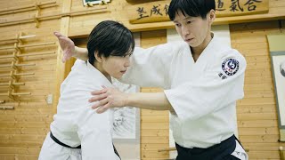 What should a Karate Woman do if an Aikido Master grabs her?