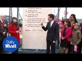 Miliband uses a giant stone to make a symbolic commitment - Daily Mail