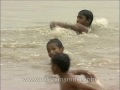 kids splashing around in the waters of yamuna river delhi